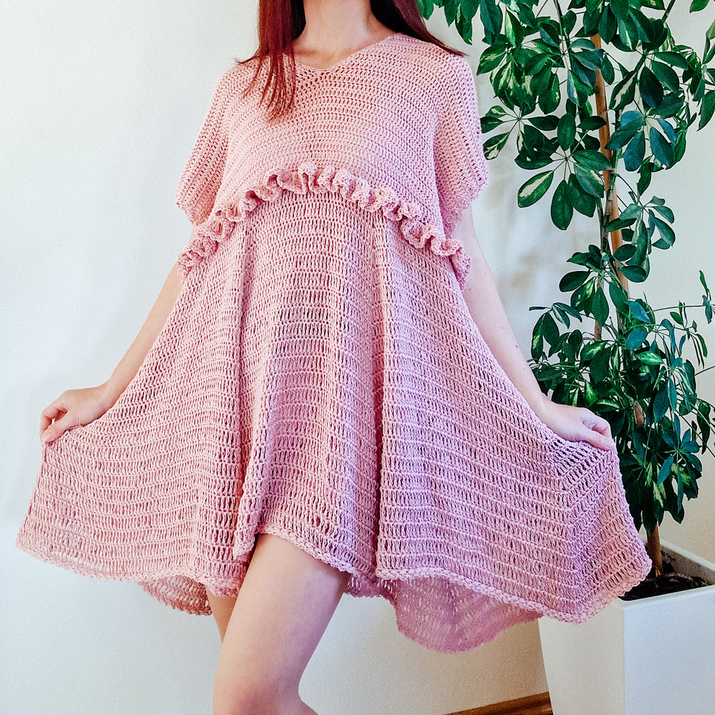 Loops Only blush ruffle summer dress with lightweight fabric and floral pattern, perfect for warm weather and casual occasions.