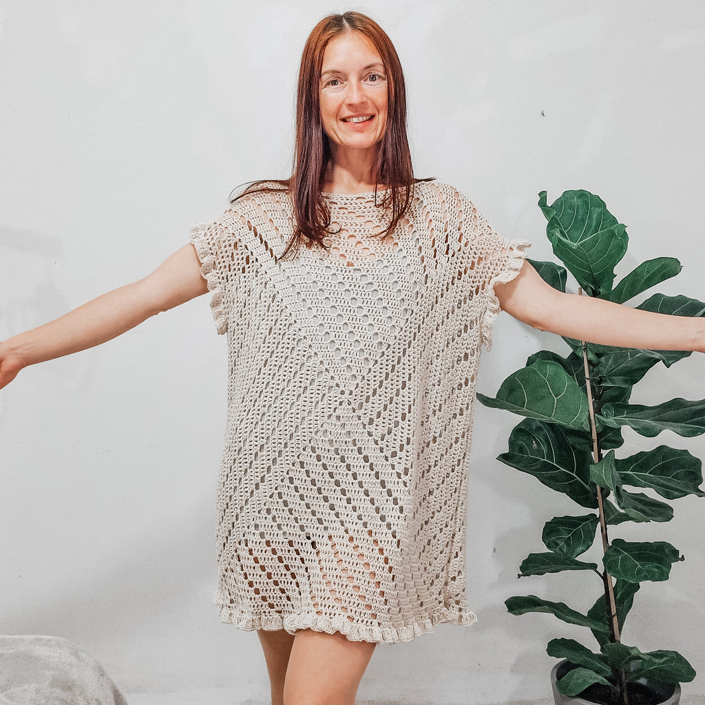 Colorful granny square summer dress by Loops Only, featuring a vibrant, lightweight dress with a crochet pattern and sleeveless design.