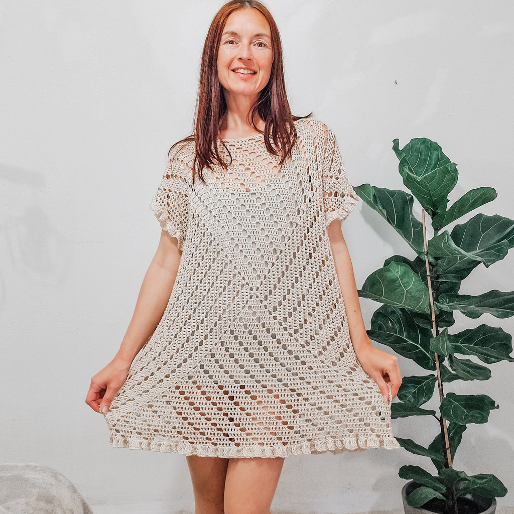 Colorful granny square summer dress by Loops Only, featuring vibrant crochet patterns and a breezy, casual style.