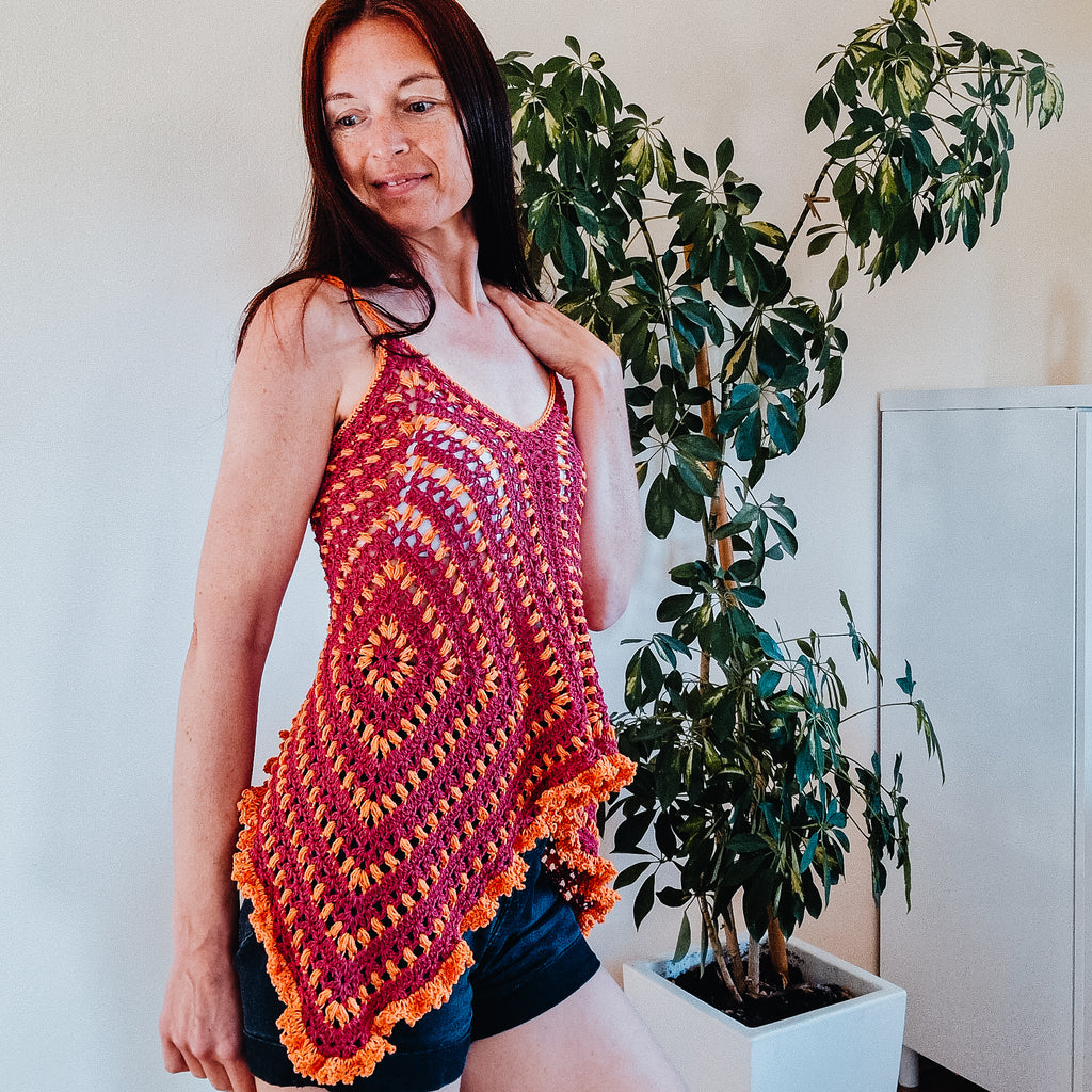 Loops Only Puff Stitch Granny Square Top featuring colorful crochet squares and a relaxed fit.