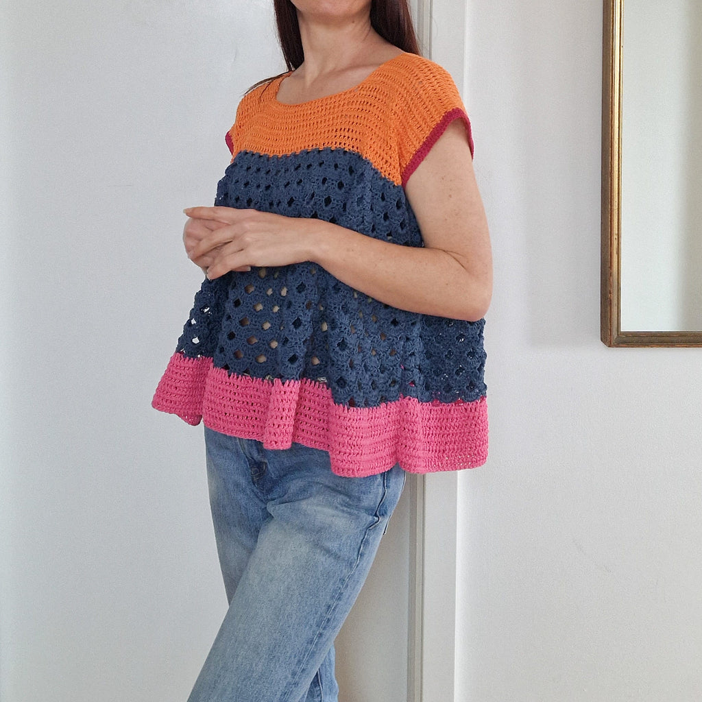 Color block top by Loops Only featuring vibrant, contrasting sections and a stylish, casual design.