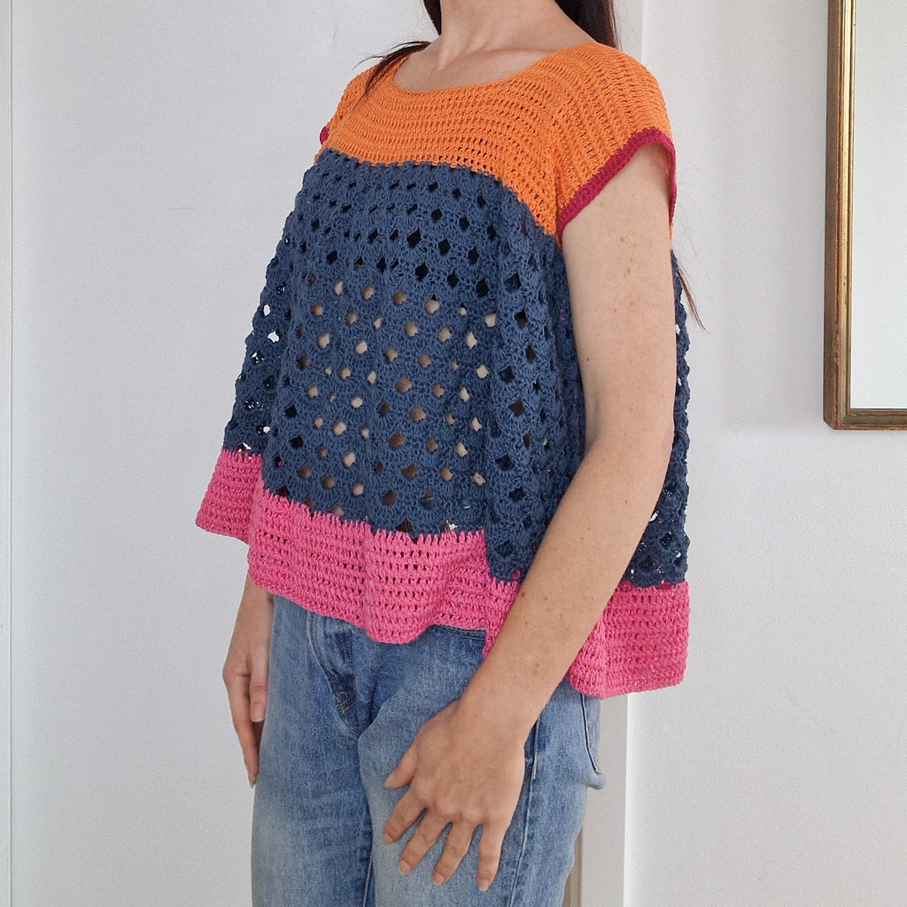 Colorful arcade-inspired block top by Loops Only, featuring bold color blocks and a stylish casual design.
