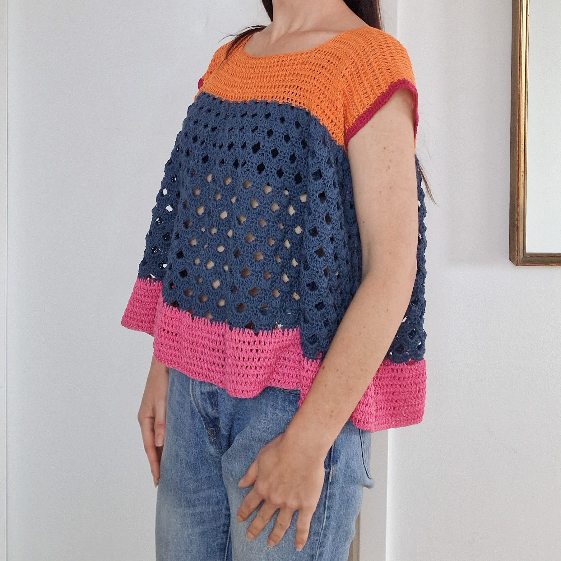 Colorful arcade-inspired block top by Loops Only, featuring bold color blocks and a stylish casual design.