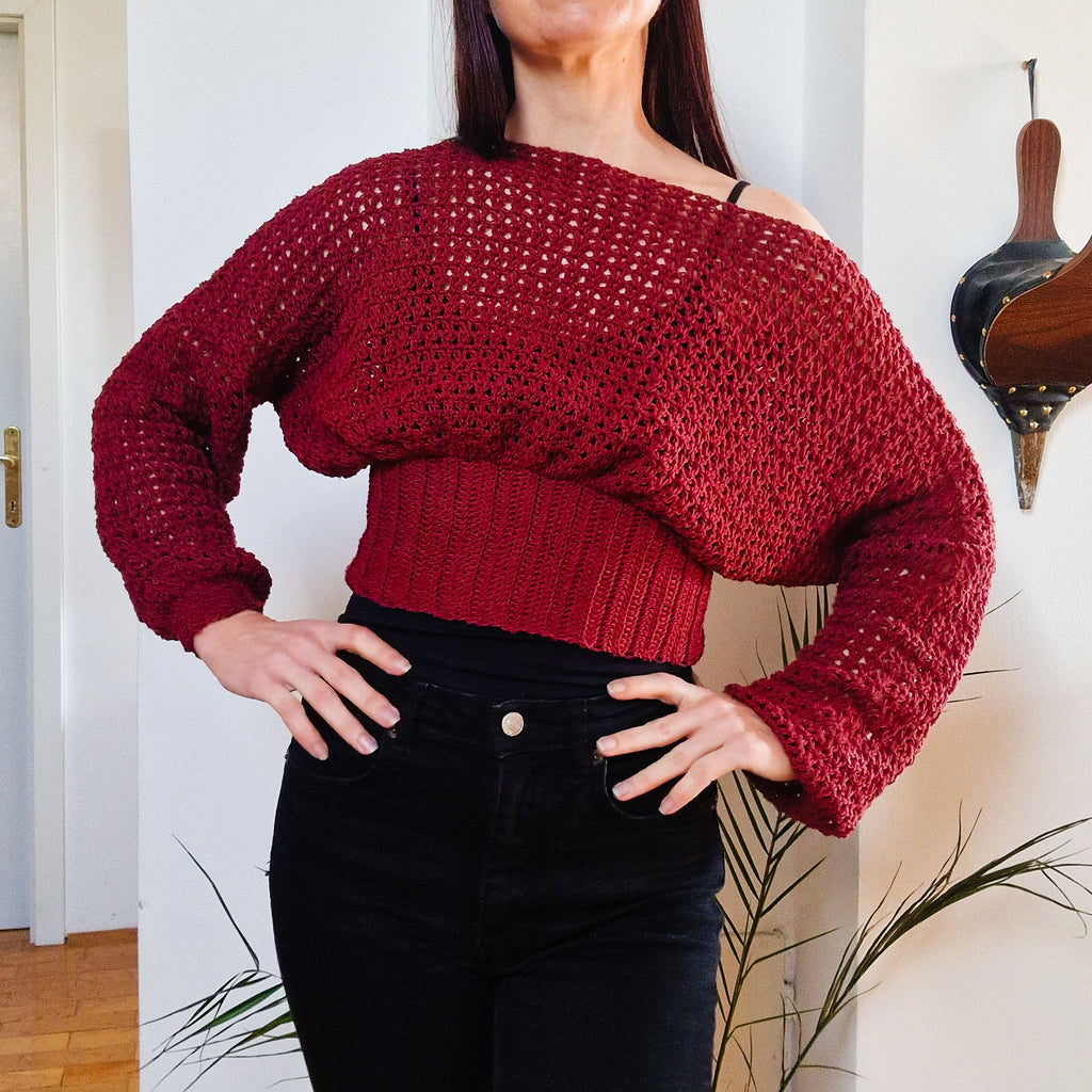 Crochet cropped bishop sleeve sweater by Loops Only, featuring textured knit and relaxed fit with wide bishop sleeves.