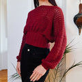 Crochet cropped sweater with bishop sleeves from Loops Only, featuring intricate stitch details and a stylish, cozy design.