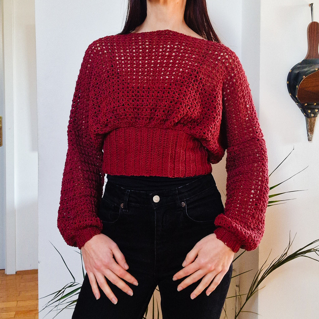 Crochet cropped bishop sleeve sweater by Loops Only featuring textured knit and relaxed fit, perfect for casual wear.