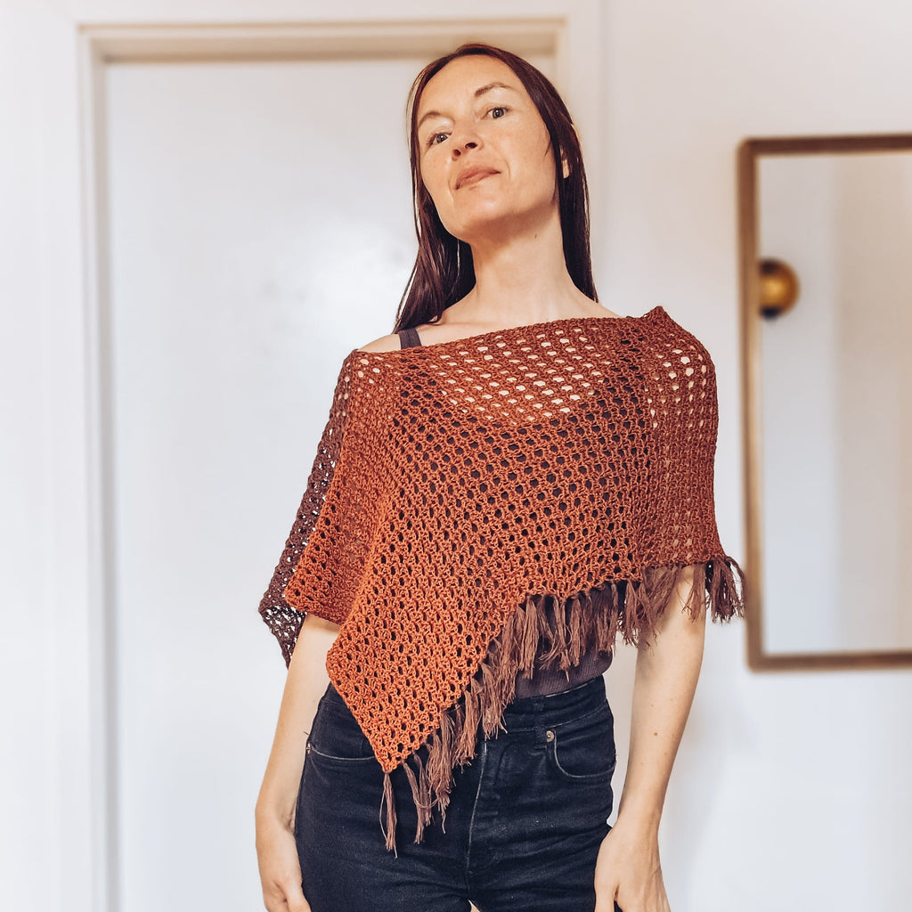 Loops Only Ember Fringe Poncho shawl with fringed edges and warm, cozy fabric, perfect for stylish layering.