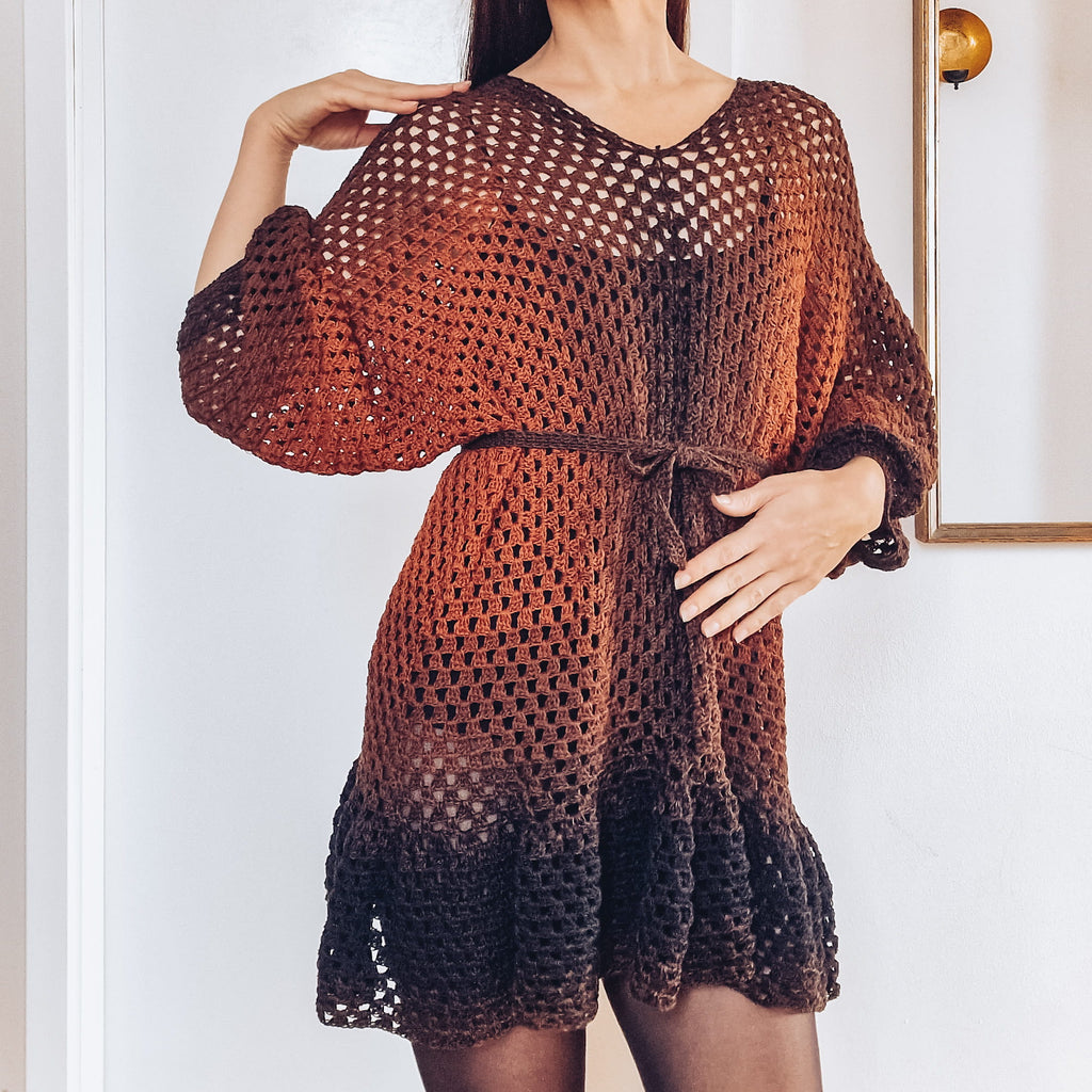 Loops Only Ember crochet cover-up dress with ruffle hem, featuring a lightweight, airy design perfect for beachwear or summer outings.