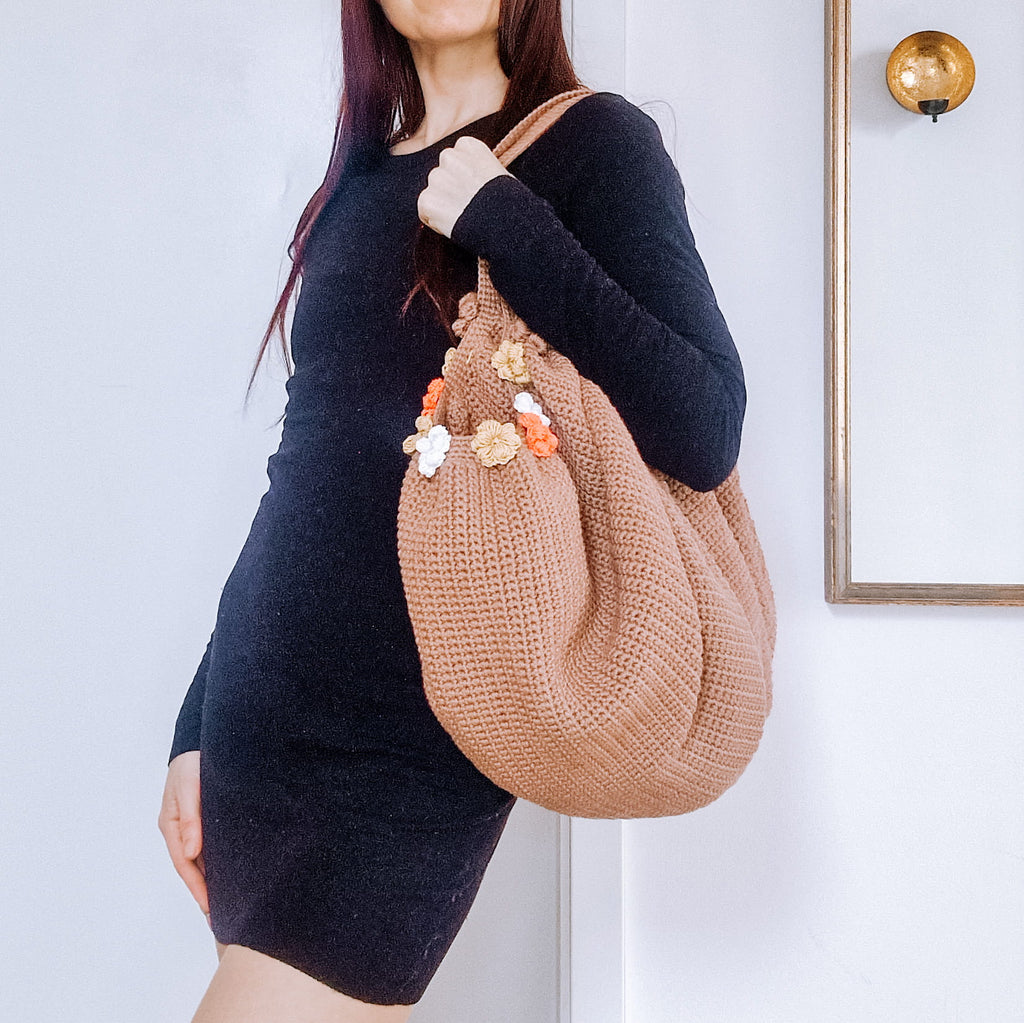 Loop Only garden tote bag with multiple pockets and sturdy handles, ideal for gardening tools and outdoor supplies.