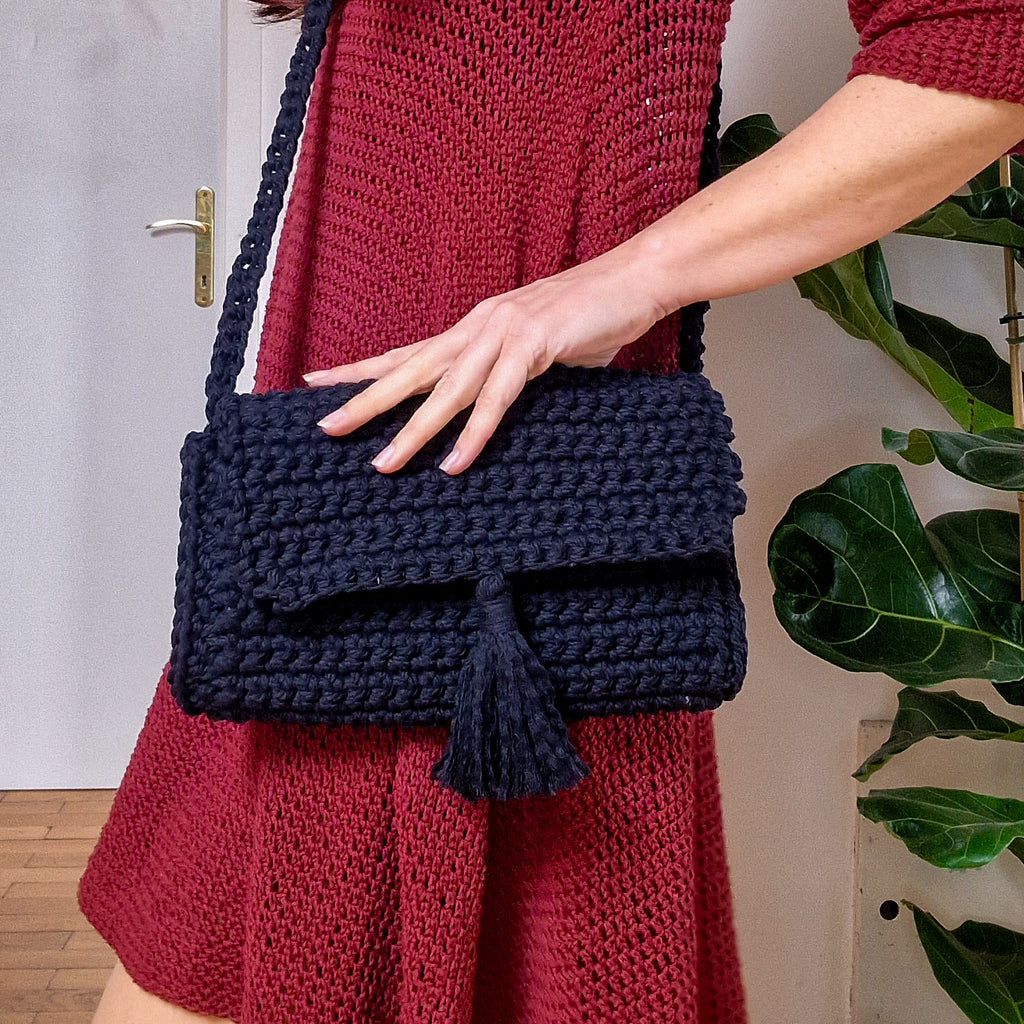 Loops Only Maven crossbody purse in black leather with adjustable strap and gold-tone hardware, stylish bag for everyday use.