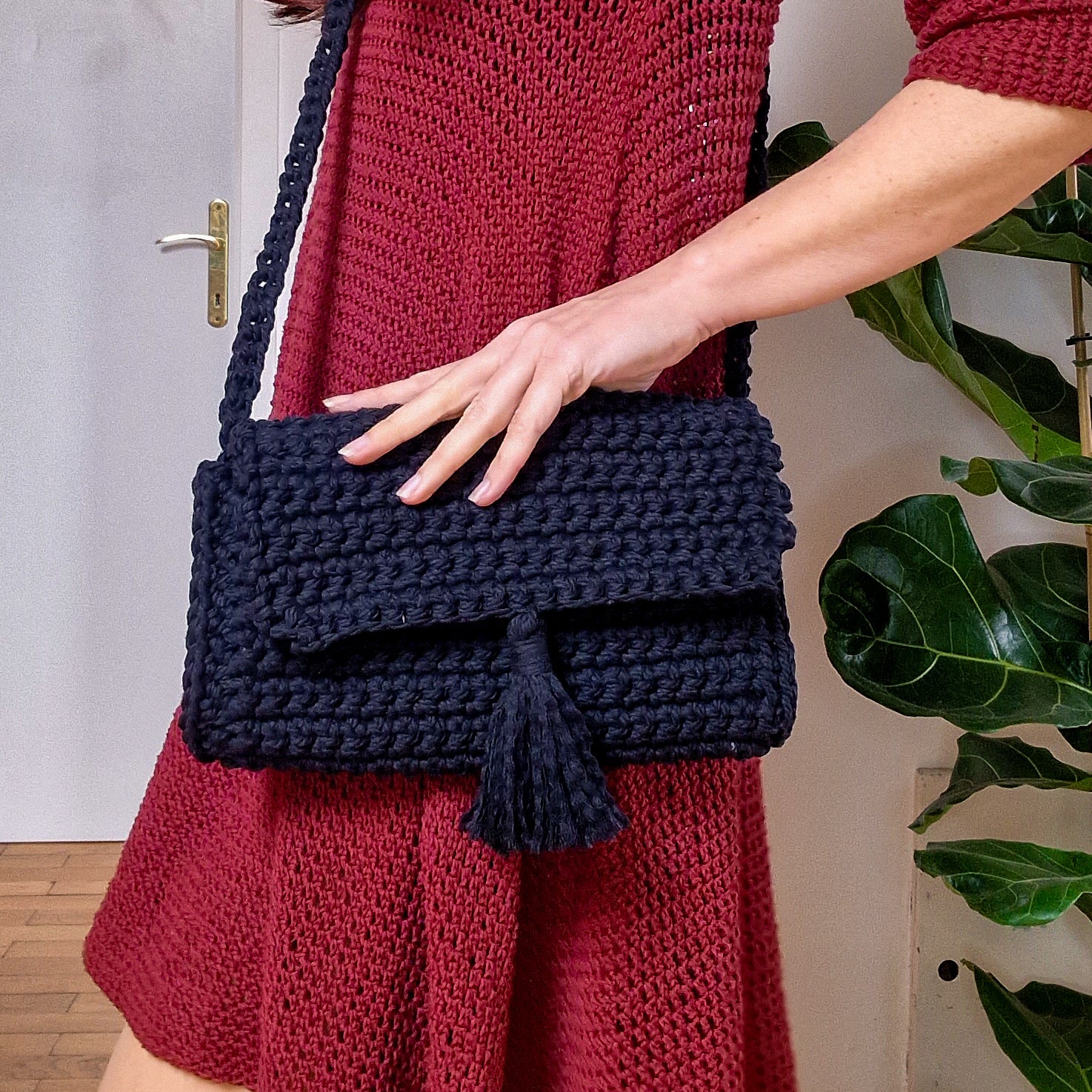 Loops Only Maven crossbody purse in black leather with adjustable strap and gold-tone hardware, stylish bag for everyday use.