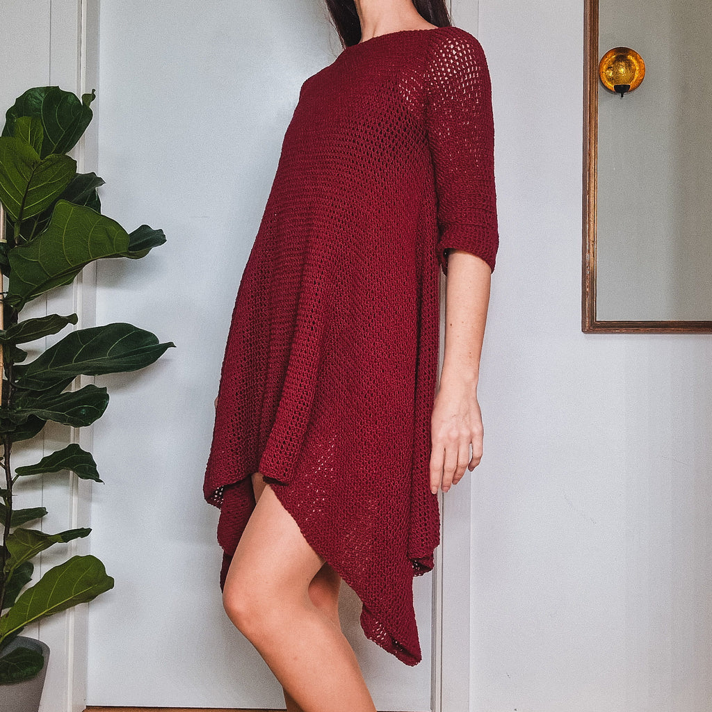 Loops Only Sway Dress showing a flowy, stylish dress with a fitted waist and sleeveless design on a hanger.