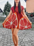 Bright citrus-colored Loops Only dress featuring a stylish, flowy design and lightweight fabric, perfect for warm weather.