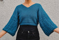 Loops Only Vivid Bubble Sweater shown in bright, colorful knit with a relaxed fit and ribbed cuffs and hem.