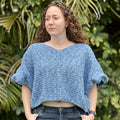 Loops Only oversized crop top featuring half double crochet knit, relaxed fit, and stylish design in neutral color.